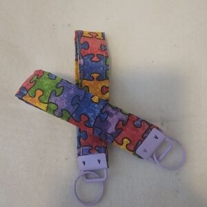 Rainbow Puzzle Piece Pacifier Clip Set